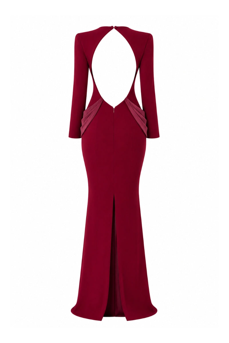 Lili Blanc crepe gown displayed on a hanger, featuring a flowing silhouette and elegant design in soft fabric.