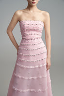 Elegant strapless A-line gown by Happy Clothing with crystal embellishments, flowing fabric, and a fitted bodice.