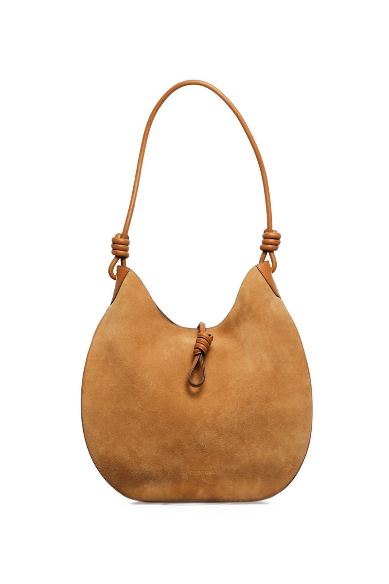 Beige suede boho shoulder bag by Folklore The Label with a relaxed, stylish design and woven strap details.