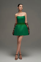 Dark green I.H.F Studio bustier mini dress, fitted with structured bodice and sleeveless design, displayed on a model.