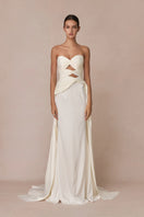 White 3-carat bustier top from Stolen Stores, stylish and fitted, with detailed bust design and sleek fabric for a modern look.