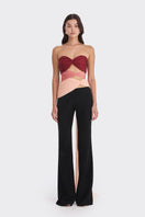 Three-tone red and peach bustier top by Stolen Stores, showcasing warm colors and stylish design.