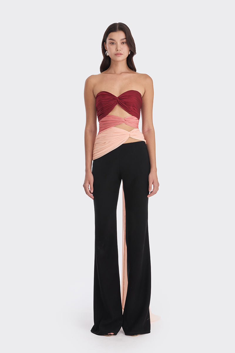 Three-tone red and peach bustier top by Stolen Stores, showcasing warm colors and stylish design.
