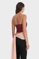 Three-tone red and peach bustier top by Stolen Stores featuring warm tones and fitted design.