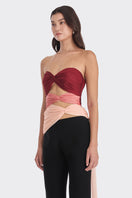 Three-tone red and peach bustier top by Stolen Stores featuring a warm-tone design and fitted style.