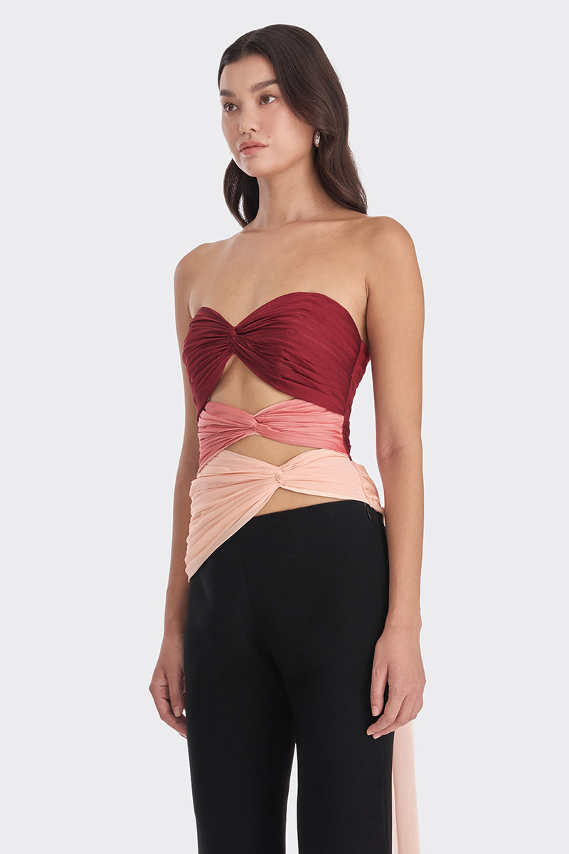Three-tone red and peach bustier top by Stolen Stores featuring a warm-tone design and fitted style.