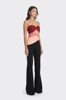 Red, peach, and warm tone bustier top by Stolen Stores featuring three carats and stylish design.