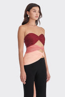Red and peach three-tone bustier top by Stolen Stores with a fitted style and warm tones, shown on a white background.