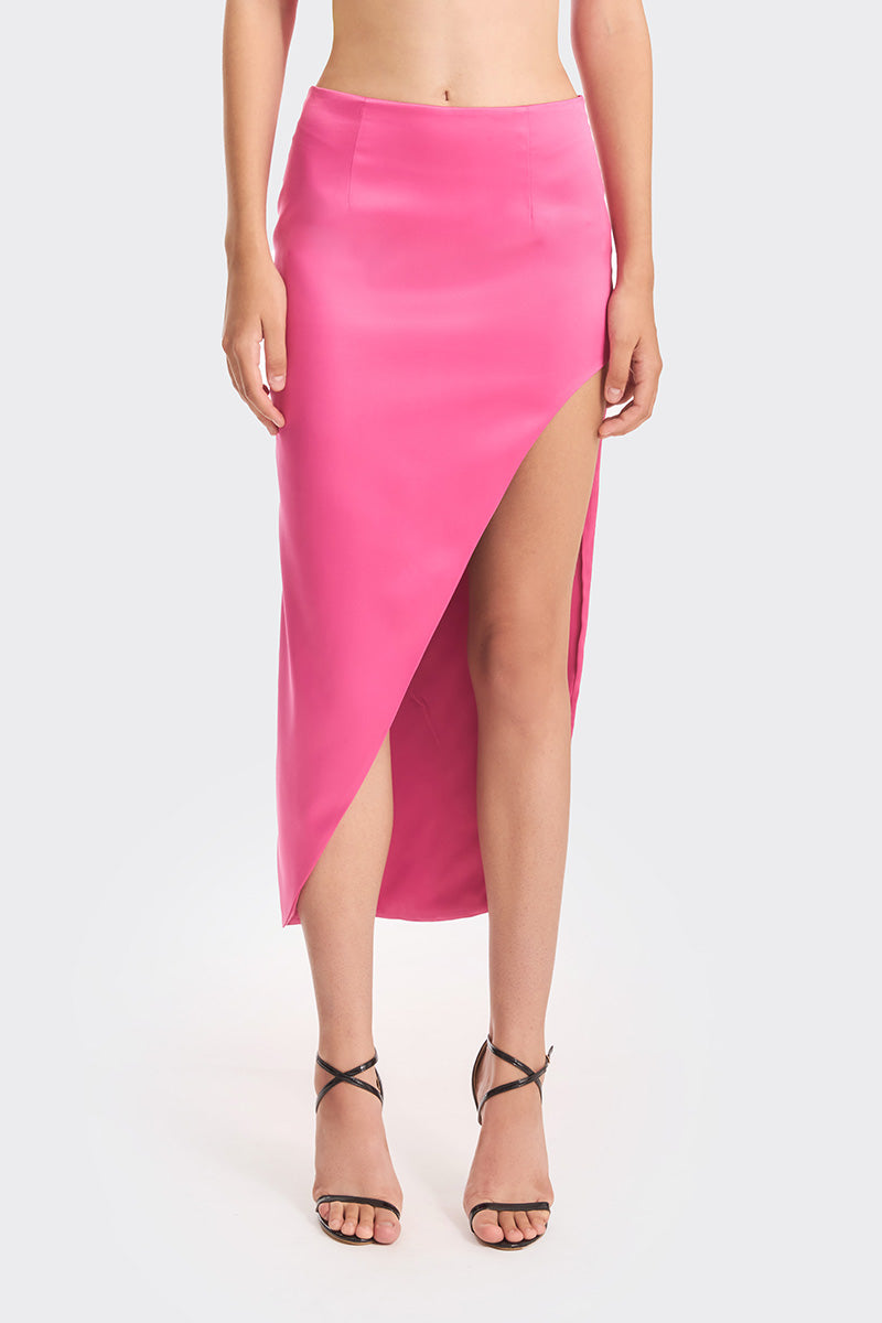 Hot pink maxi skirt by Stolen Stores, featuring a flowing design and vibrant color, perfect for stylish summer outfits.