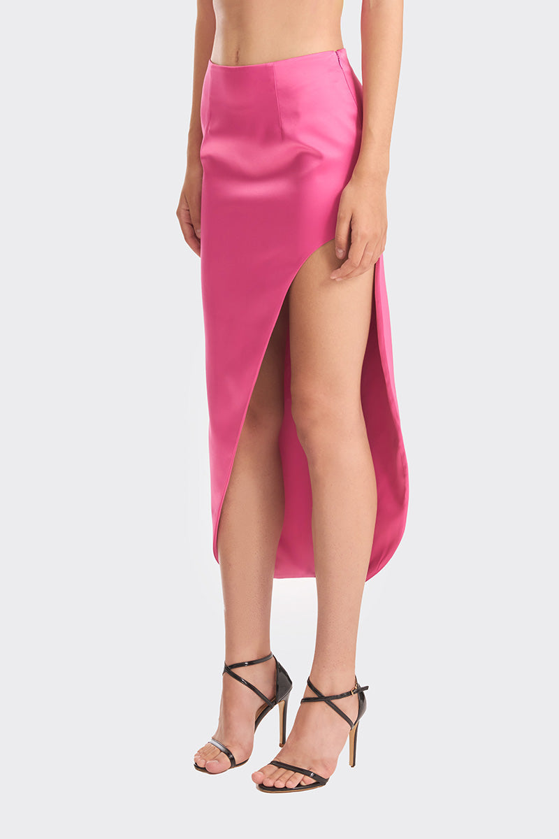 Hot pink maxi skirt from Stolen Stores featuring a flowing design and 3-carat embellishments, perfect for stylish summer wear.