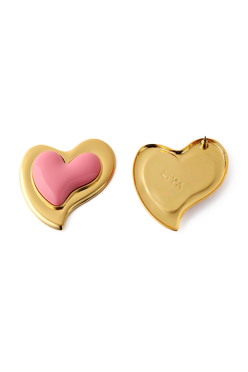 Liya Heartfelt pink earrings featuring delicate heart-shaped design and vibrant pink color, perfect for accessorizing.