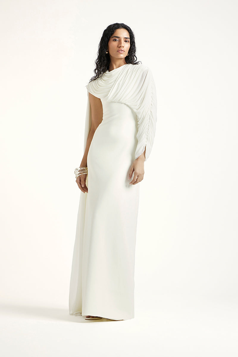 Deme By Gabriella Arienne off-white maxi dress with flowing fabric and elegant design, perfect for summer or special occasions.