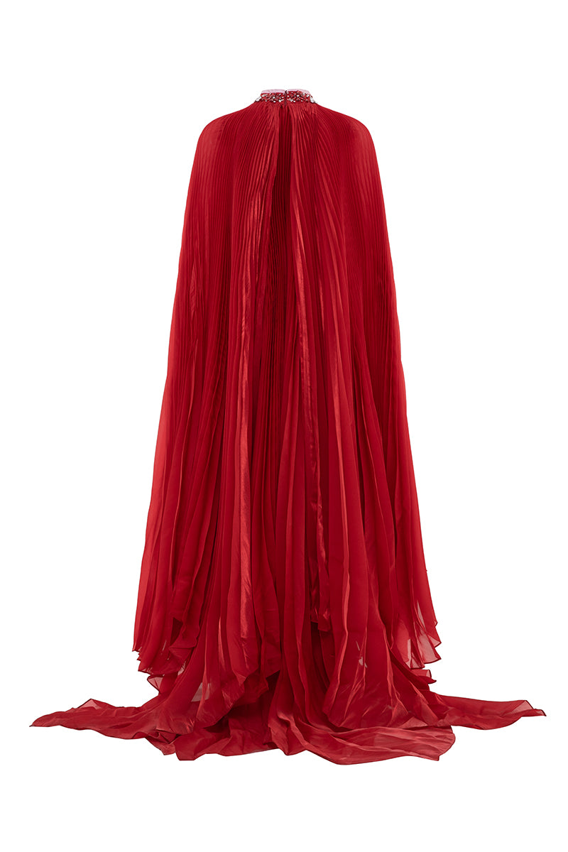 Valenciani red pleated high-neck cape gown with elegant flowing design, perfect for formal occasions.