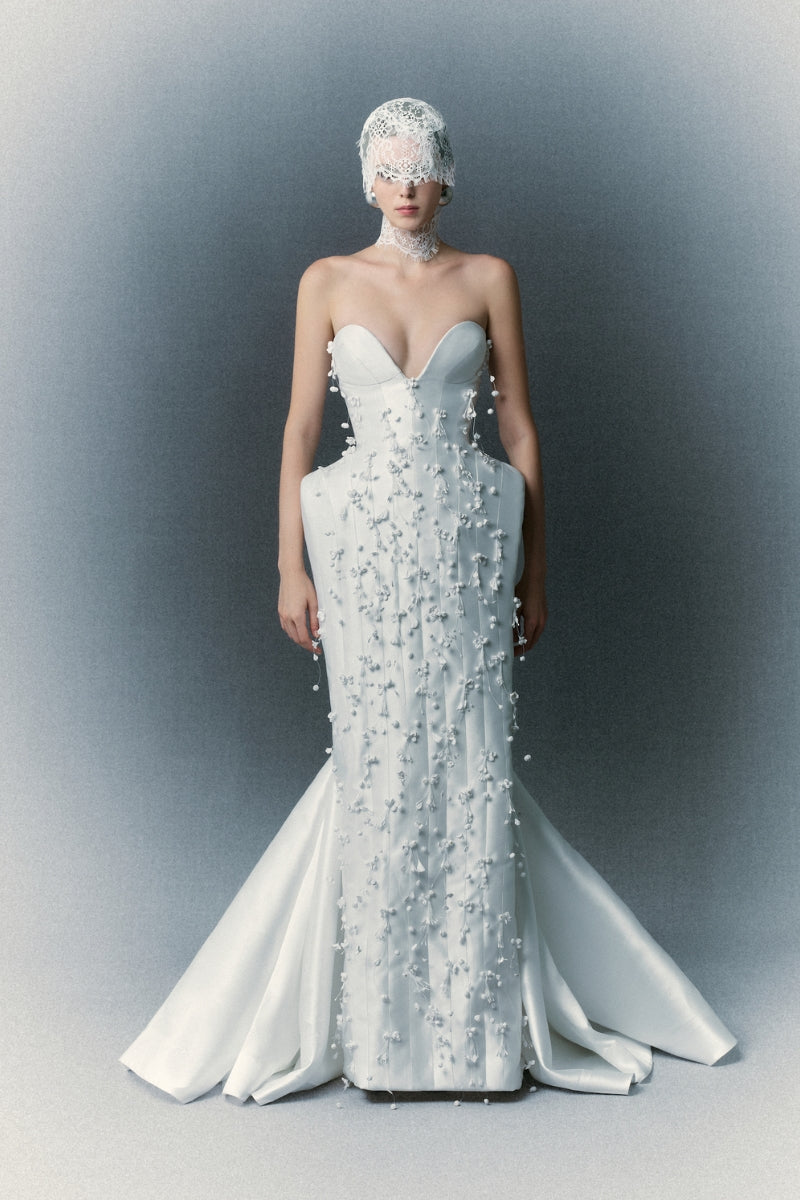White Plan Christopher gown with elegant fabric and detailed design, perfect for formal occasions and special events.