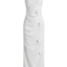 Keira Tong ripple maxi dress with flowing fabric and adjustable straps, styled with a relaxed fit and elegant design.