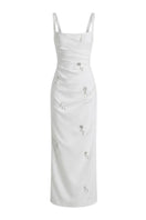 Keira Tong ripple maxi dress with flowing fabric and adjustable straps, styled with a relaxed fit and elegant design.