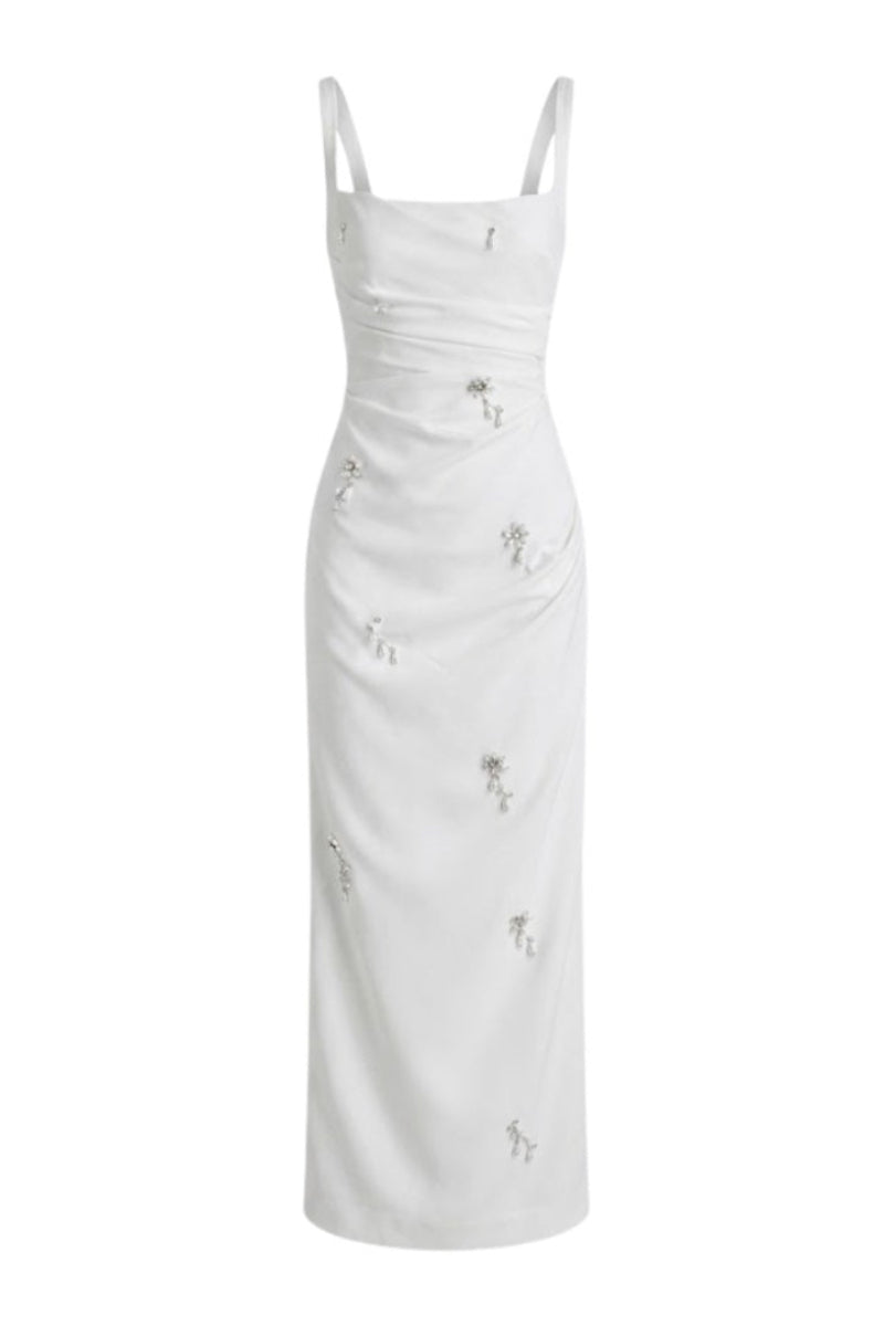 Keira Tong ripple maxi dress with flowing fabric and adjustable straps, styled with a relaxed fit and elegant design.