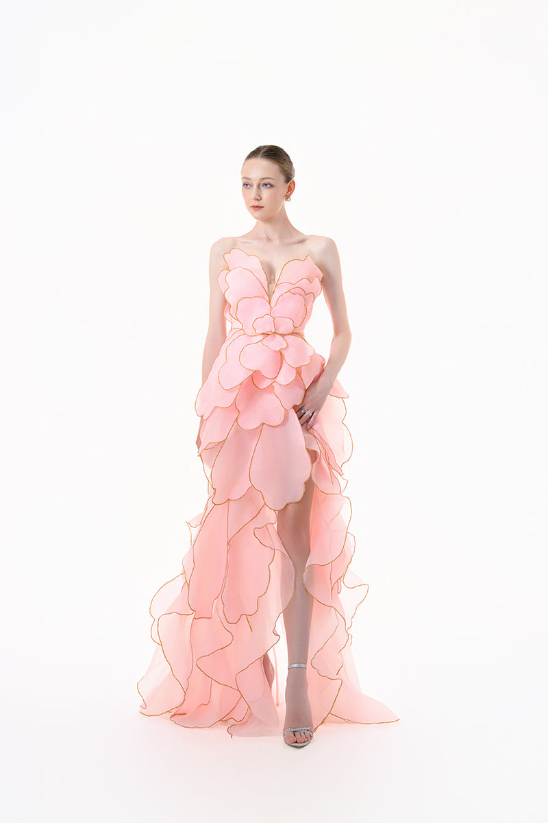 Elegant blooming blush rose tiered gown by Happy Clothing, featuring flowing fabric and floral design for special occasions.