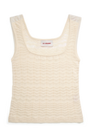 Cream-colored La Granni Marsito top with short sleeves and round neckline, displayed on a hanger.