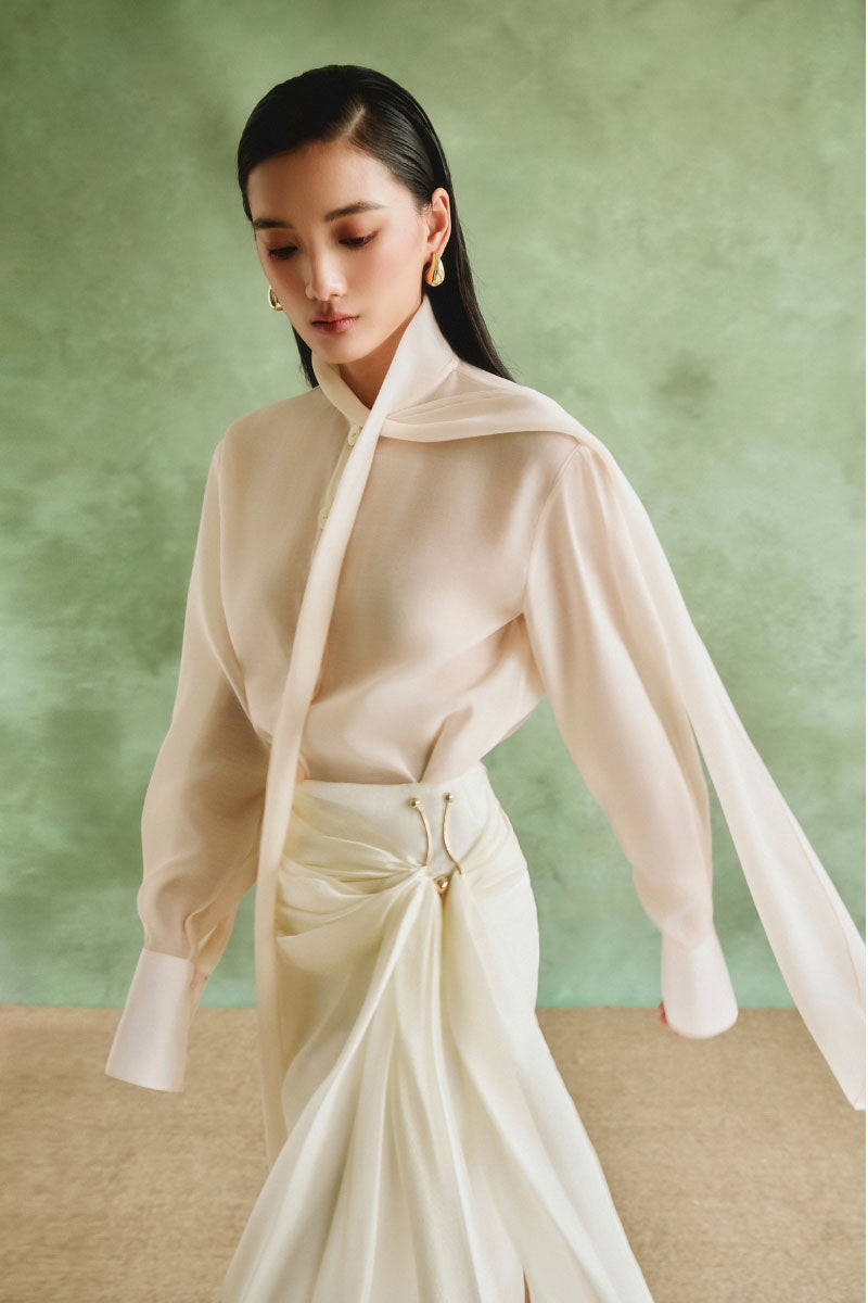 White Plan Ivory Grace set co-ords featuring a stylish crop top and matching high-waisted pants on a model.