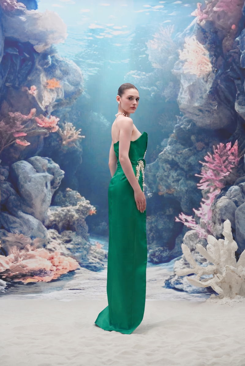 Emerald green Sirena water silk taffeta gown by 21Six, featuring a flowing silhouette and elegant design.