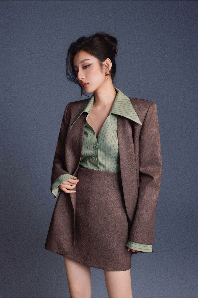 Keira Tong tailored cinched shirt featuring a fitted design, long sleeves, and a stylish, structured silhouette.