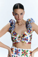 Nur Karaata Lily Sicilia bikini set featuring a vibrant patterned top and matching bottoms, perfect for beachwear.