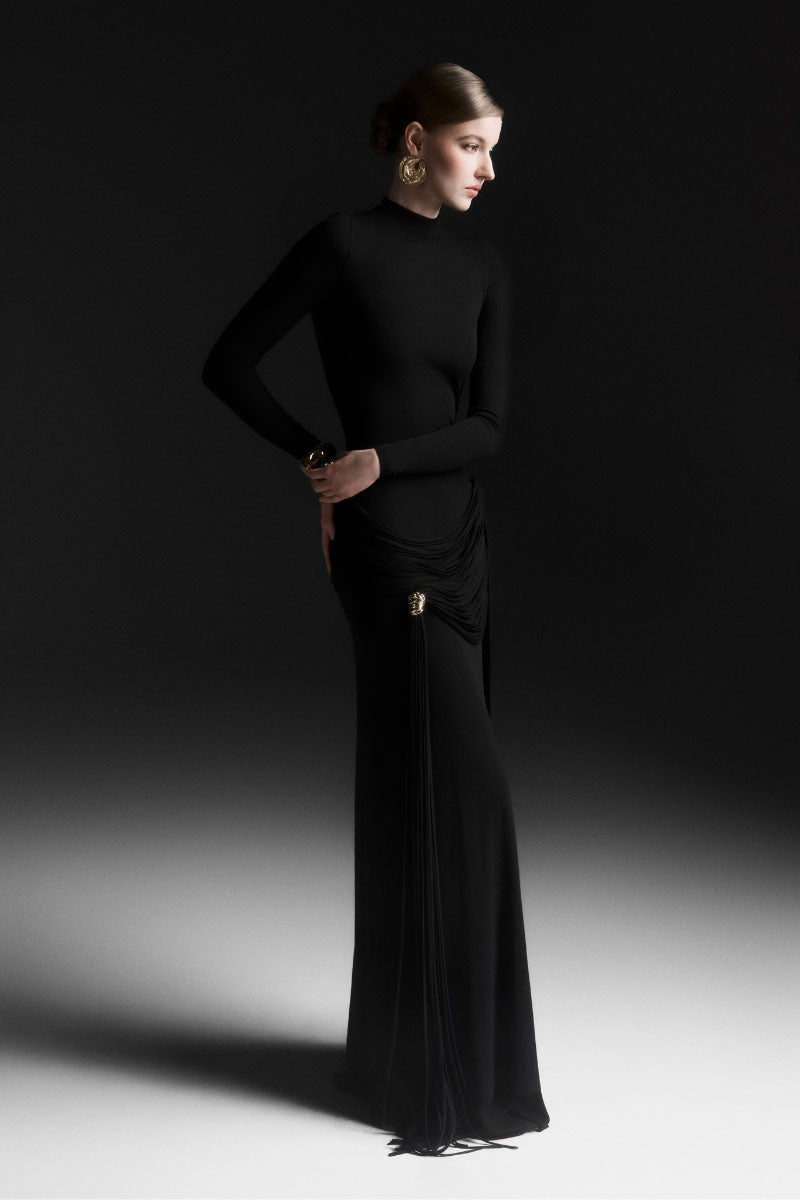 Black Maison Des Copains Mirae high neck floor-length maxi dress displayed on a hanger with elegant fabric details.