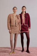 Lalo Rozany beige knitted jacket, stylish and cozy, displayed on a hanger with detailed knit pattern and casual fit.