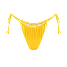 Yellow glossy bikini bottom from Suncillo VIRNA collection, featuring sleek fabric and a stylish fit for beachwear.