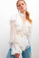 OvertheSea Ocean of Tenderness blouse in milky white, lightweight top with soft fabric and delicate design, displayed on a hanger.