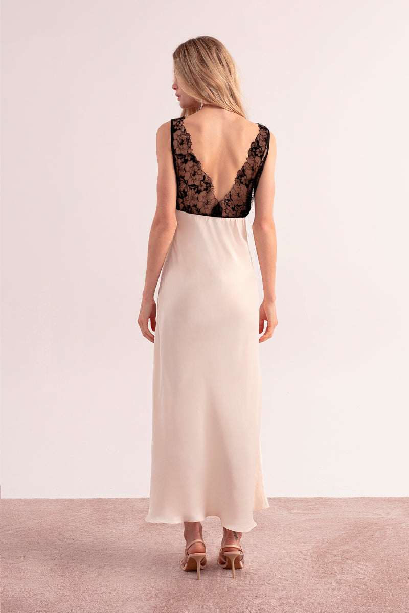 OvertheSea ivory shadow maxi dress with flowing fabric and elegant design, displayed on a mannequin.