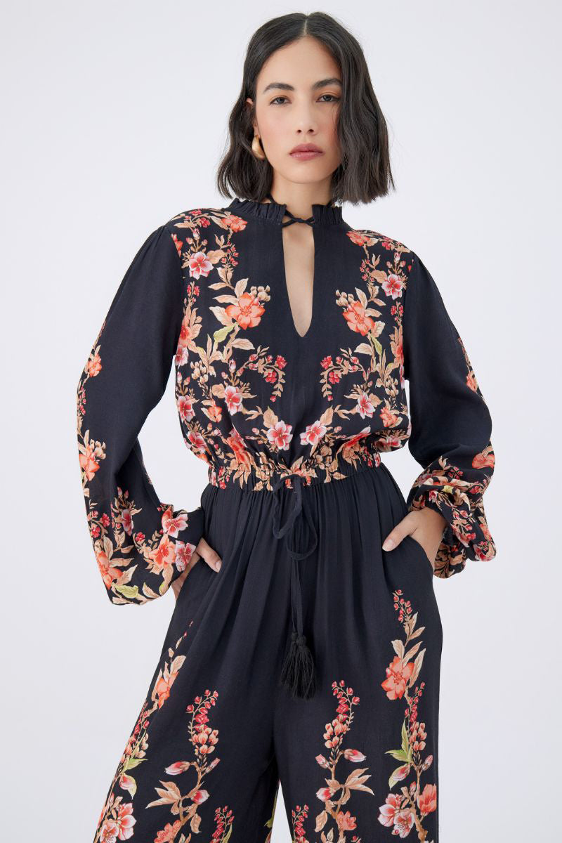 Raishma Viviana jumpsuit in stylish fabric, featuring a fitted bodice and wide-leg pants, perfect for elegant occasions.