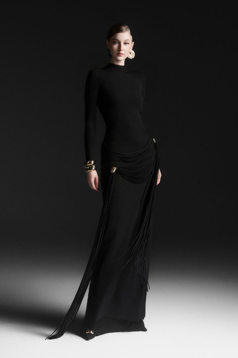 Black Maison Des Copains MIRÉA high neck floor-length maxi dress displayed on a hanger with flowing fabric.