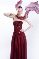 Elegant burgundy LEDIEL Alina gown showcasing flowing fabric and sophisticated design for formal occasions.