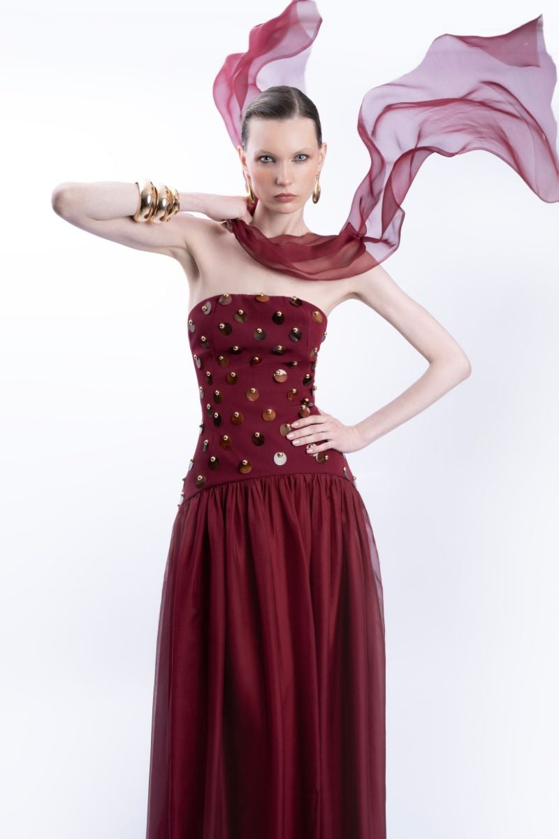 Elegant burgundy LEDIEL Alina gown showcasing flowing fabric and sophisticated design for formal occasions.