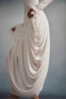 White Plan Aurélia draped maxi dress featuring flowing fabric and elegant design, perfect for formal or casual occasions.