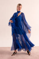 OvertheSea blue depth maxi dress displayed on a hanger, featuring a flowing fabric and elegant design.