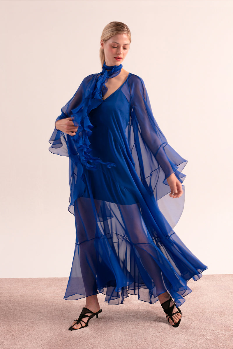 OvertheSea blue depth maxi dress displayed on a hanger, featuring a flowing fabric and elegant design.