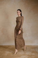 Black Noir midi dress by Arti Apparel featuring a fitted silhouette and elegant design, displayed on a mannequin.