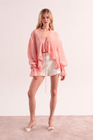Overthesea splash pink blouse, stylish women's top with a flowy design and vibrant color, displayed on a mannequin.