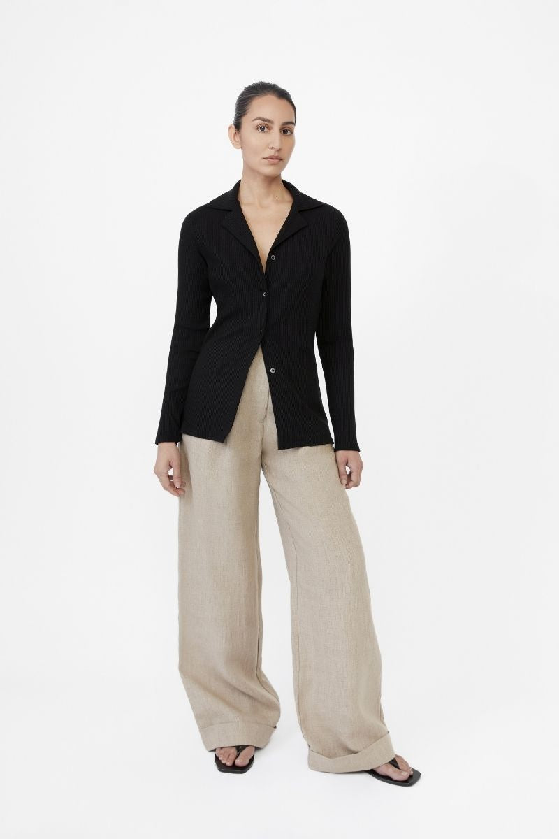 Dāl the Label modal rib knit collared cardigan with button closure and long sleeves, styled in a neutral color.