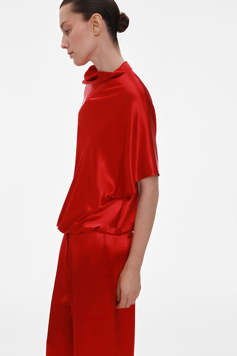 Red loose-fit viscose blouse by ELENAREVA, featuring a relaxed style and lightweight fabric, shown on a hanger.