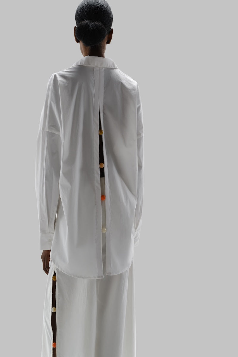 Baobab Wayra shirt with a relaxed fit and stylish design, displayed on a hanger against a neutral background.