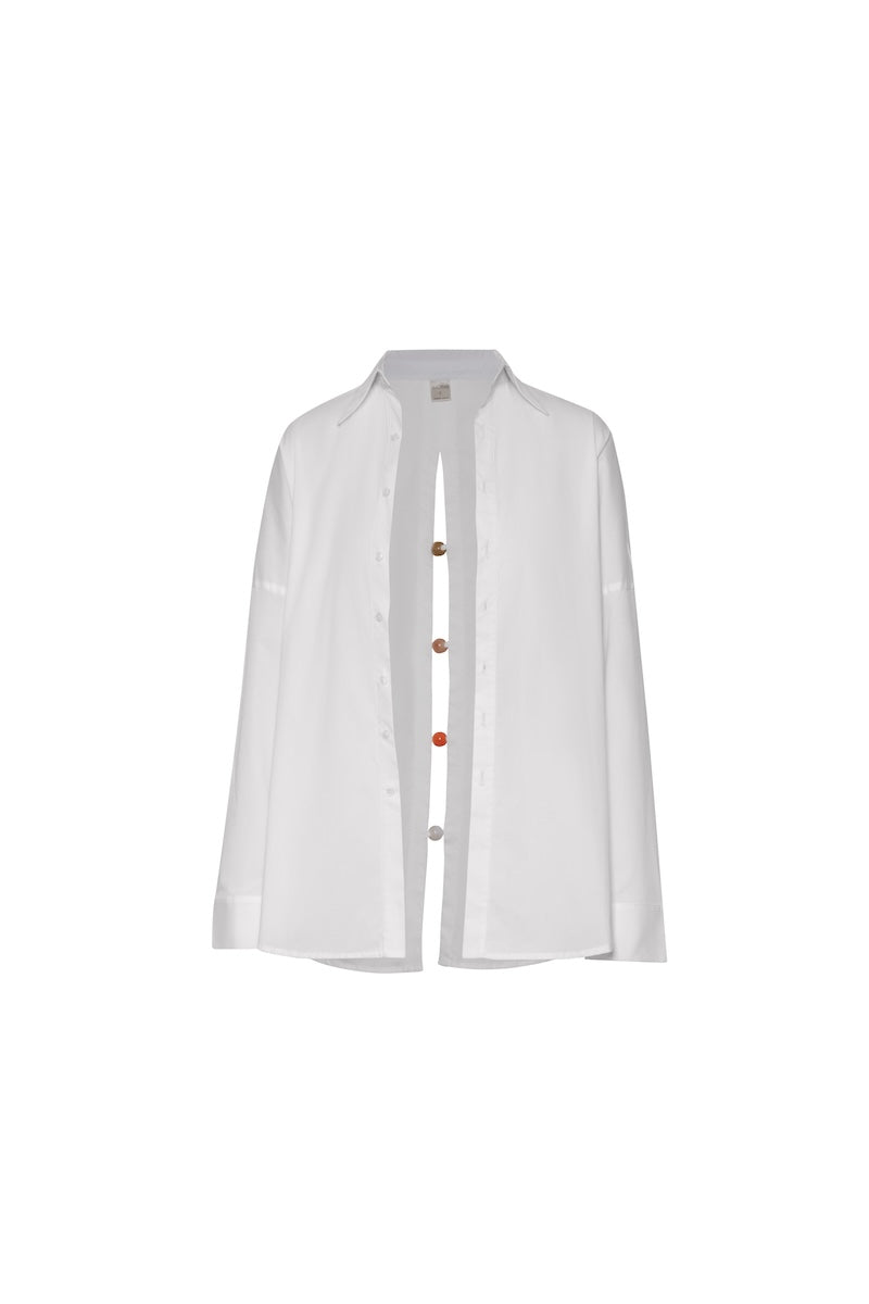 Baobab Wayra shirt displayed on a hanger, featuring a lightweight fabric and casual style perfect for everyday wear.