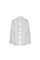 Baobab Wayra shirt in Salina fabric displayed on a hanger, showcasing its stylish design and vibrant colors.