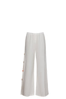 Baobab WAYRA pants in a stylish design, shown in a natural fabric with a relaxed fit, perfect for casual wear.