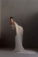 White Plan Narcotic Dress gown with elegant design, featuring a flowing fabric and stylish silhouette.