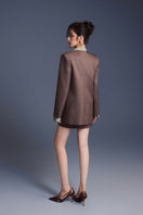 Keira Tong minimal fitted blazer shown on a model, tailored design, classic lapels, and sleek fit for stylish professional look.