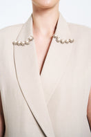Cream Aidan & Ice Caleste blazer shown on a hanger, featuring a tailored fit and classic lapel design.